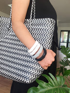 Mum wearing a silicone teething bangle as a nursing tracker and baby teether