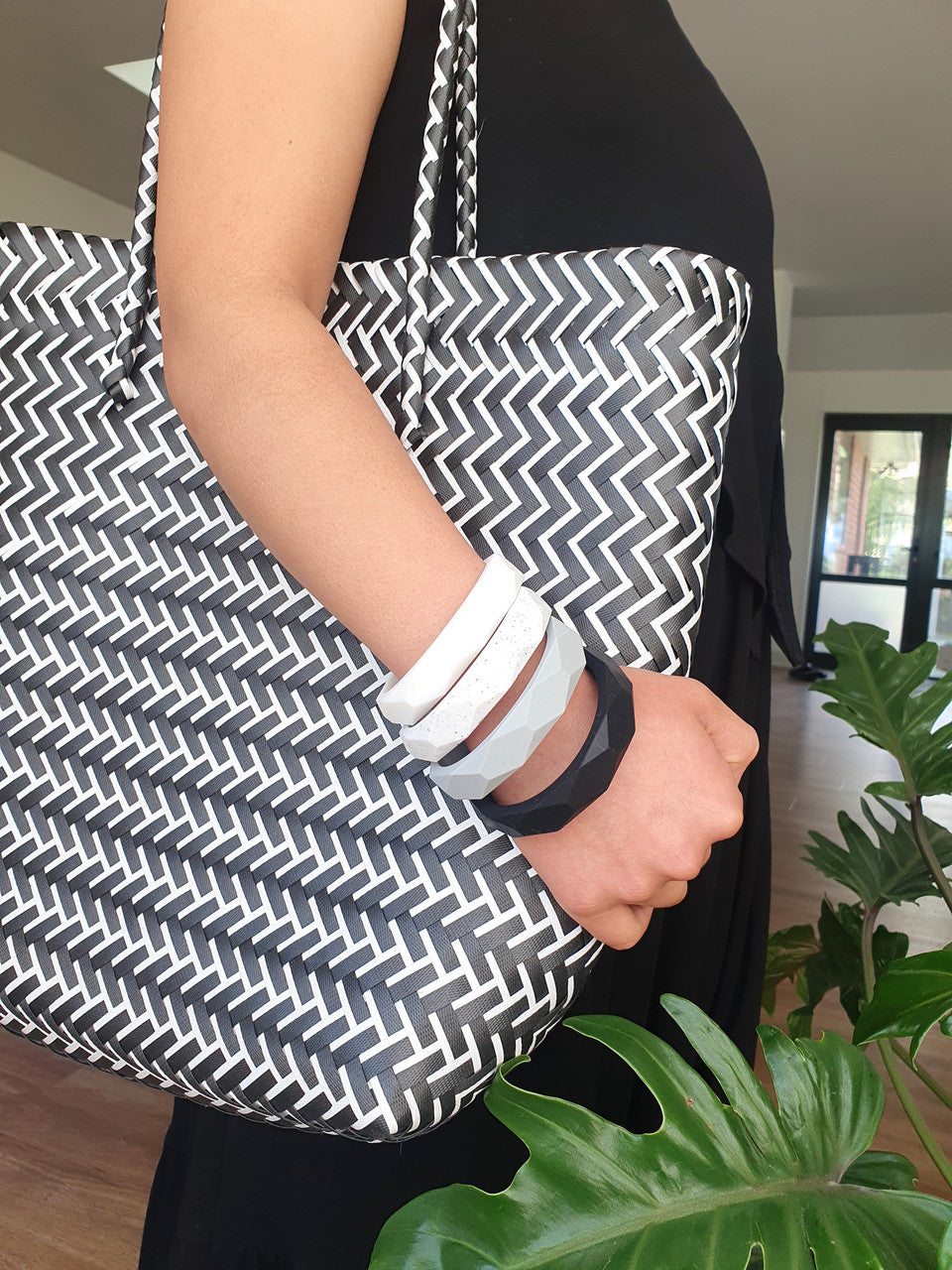 Mum wearing a silicone teething bangle as a nursing tracker and baby teether
