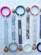 Non-toxic food-grade silicone teething bracelet with round disc texture.